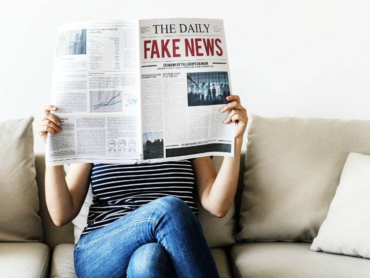 woman reading fake news