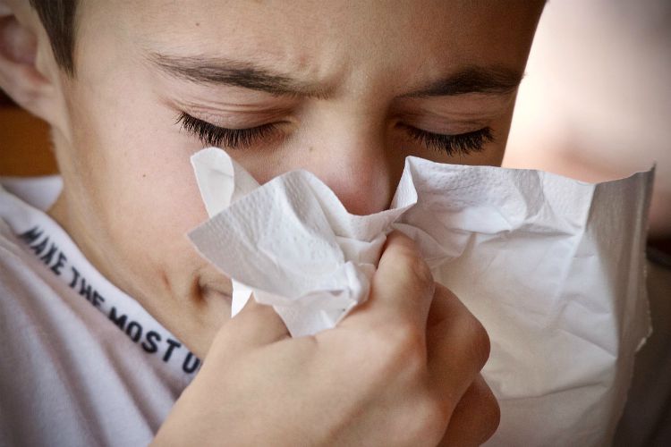 boy sneezing sinuses