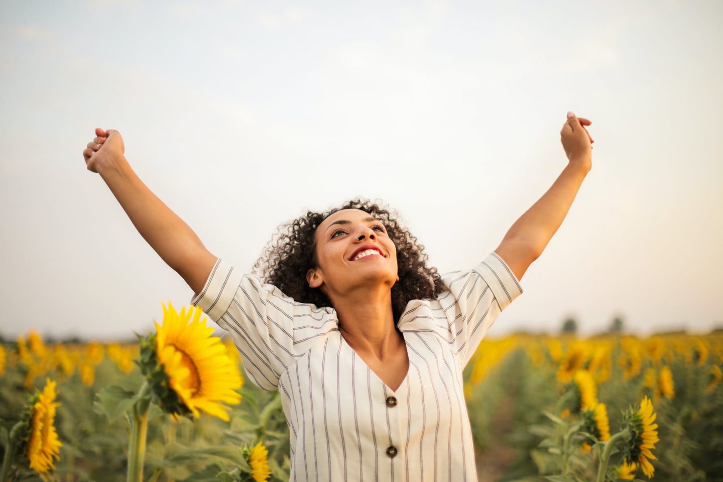 Happy sunflower woman